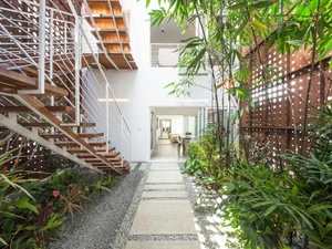 Innovative Void Designs and Staircases for Natural Light in Modern Homes - image 1