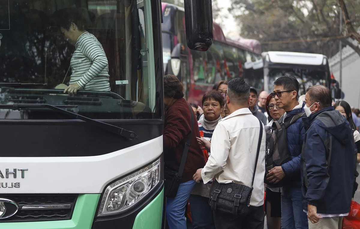 Large Tourist Buses Impact Traffic in Hanoi Old Quarter