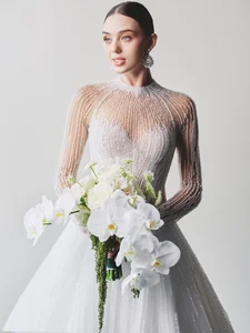 Dianka Zakhidova Captivates in a Sheer Wedding Gown for Bui Tien Dung Marriage - image 6