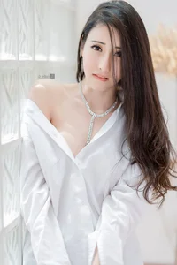 The Timeless Elegance of the Classic White Shirt: A Gallery of Sophisticated and Alluring Styles - image 7