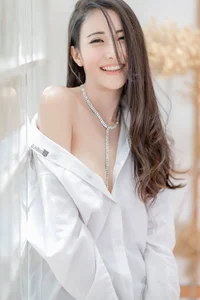 The Timeless Elegance of the Classic White Shirt: A Gallery of Sophisticated and Alluring Styles - image 2