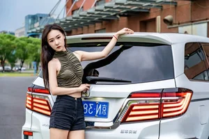 Stunning Chinese Model Poses with Classic Honda Motorcycle - image 5