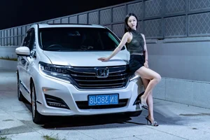Stunning Chinese Model Poses with Classic Honda Motorcycle - image 0