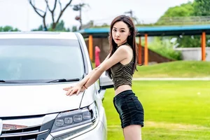 Stunning Chinese Model Poses with Classic Honda Motorcycle - image 1