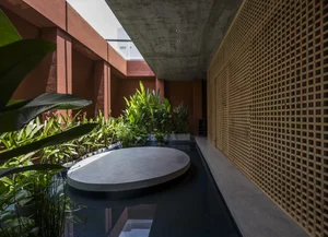 Stunning Communal House Inspired Red Villa Amidst Lush Greenery in Ho Chi Minh City - image 5