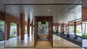 Stunning Communal House Inspired Red Villa Amidst Lush Greenery in Ho Chi Minh City - image 0