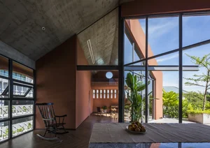 Stunning Communal House Inspired Red Villa Amidst Lush Greenery in Ho Chi Minh City - image 1