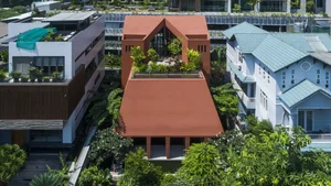 Stunning Communal House Inspired Red Villa Amidst Lush Greenery in Ho Chi Minh City - image 4