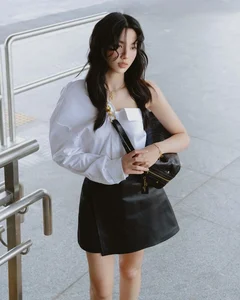 Miss Grand International Thùy Tiên Redefines Youthful Elegance in a Classic White Shirt Look - image 2