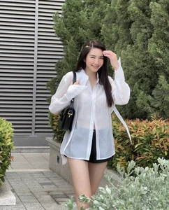 Miss Grand International Thùy Tiên Redefines Youthful Elegance in a Classic White Shirt Look - image 5