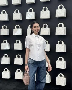 Miss Grand International Thùy Tiên Redefines Youthful Elegance in a Classic White Shirt Look - image 4