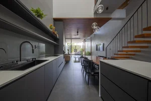 Stunning Green Tube House Architecture in the Heart of the Modern City - image 2