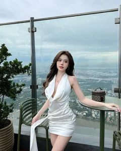 Popular TikToker Captivates Fans with Elegant Deep-Neck Dress and Unique Beauty Mark - image 1