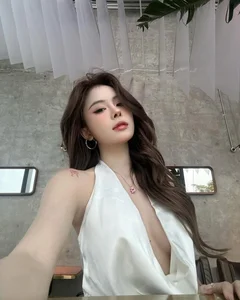 Popular TikToker Captivates Fans with Elegant Deep-Neck Dress and Unique Beauty Mark - image 3