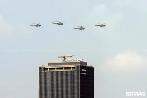 Aerial Spectacle: Fighter Jets and Helicopters Train Over Ho Chi Minh City - image 6
