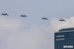 Aerial Spectacle: Fighter Jets and Helicopters Train Over Ho Chi Minh City - image 23