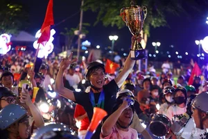 Millions Flood the Streets as Vietnam Celebrates ASEAN Cup 2024 Championship - image 35