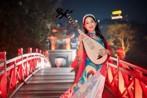 Pipa Artist Vu Dieu Thao Transforms Into Co Doi Thuong Ngan for Tet MV - image 0