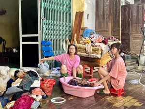 Yen Bai Flood Cleanup: Residents Battle Mountains of Mud and Debris - image 10