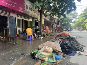 Yen Bai Flood Cleanup: Residents Battle Mountains of Mud and Debris - image 9