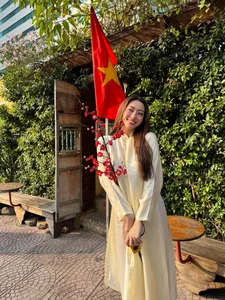 Vietnamese Celebrities Shine in Elegant Ao Dai for Tet Celebrations - image 3