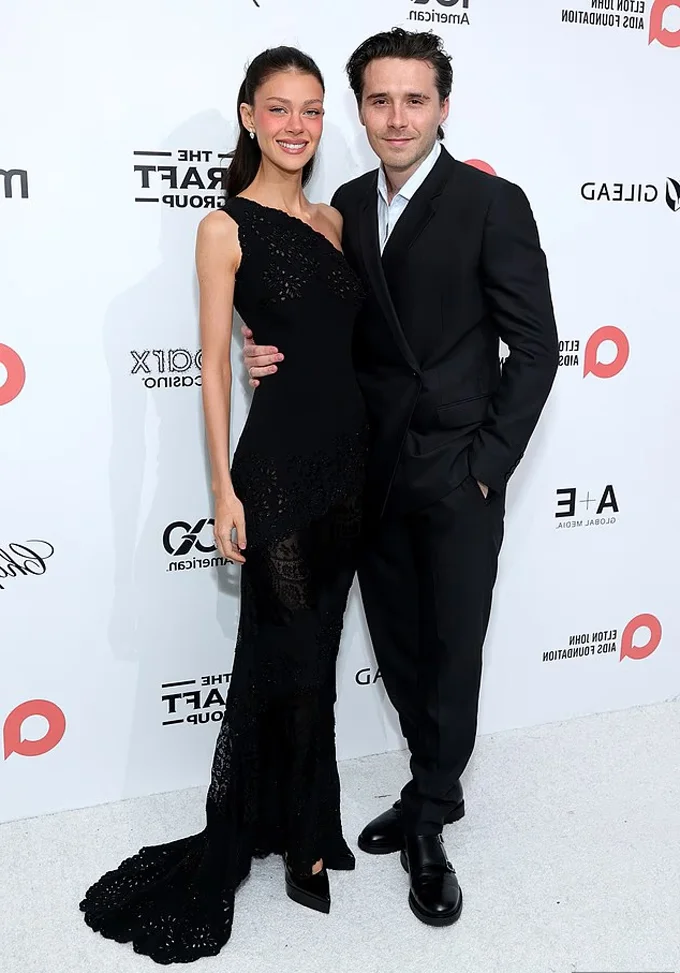 Brooklyn Beckham and Nicola Peltz Beckham’s Glamorous Red Carpet Appearance at Elton John’s Iconic Oscar Party