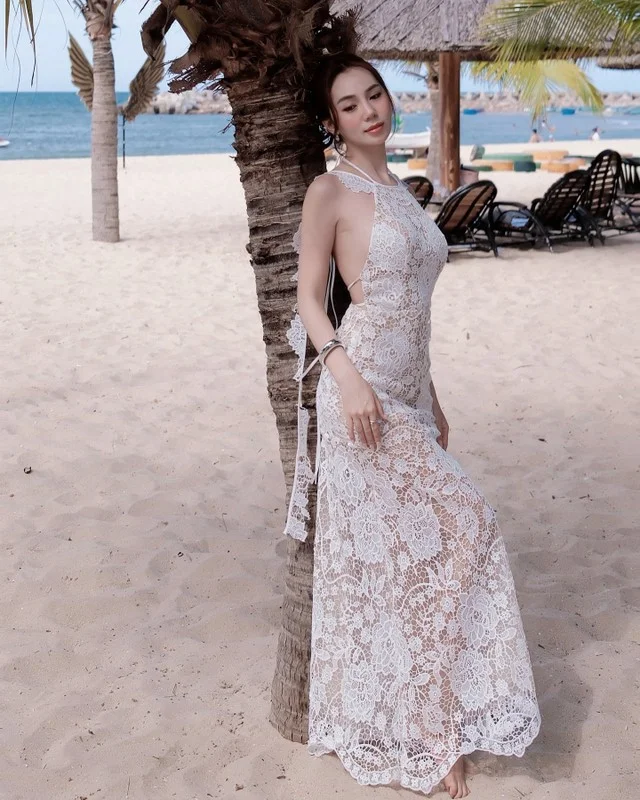 Viral TikToker Stuns in Sheer Lace Dress: A Masterclass in Beachfront Fashion
