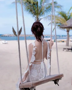 Viral TikToker Stuns in Sheer Lace Dress: A Masterclass in Beachfront Fashion - image 6
