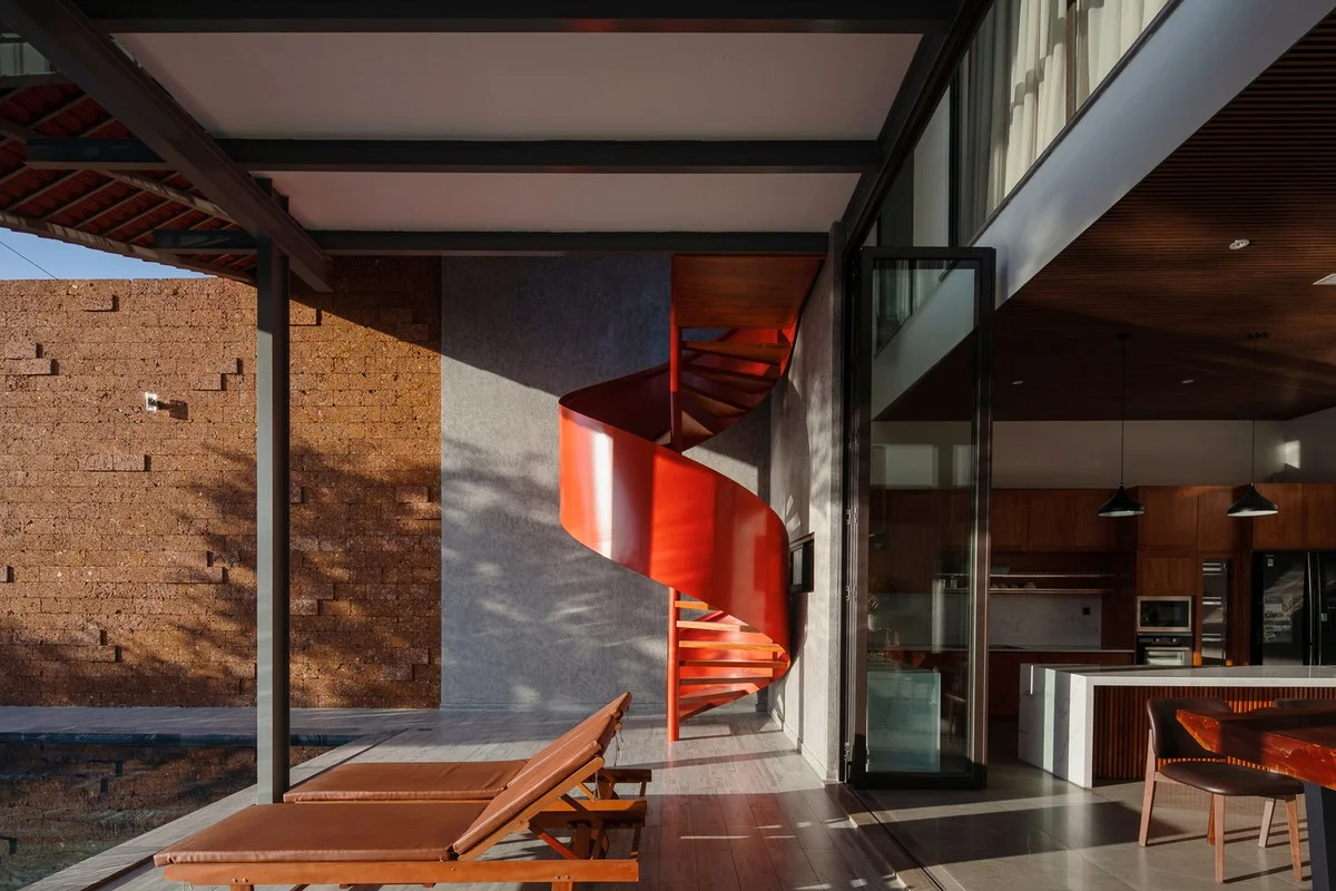 Discover the Unique Laterite Stone House with an Innovative Folding Roof in Saigon