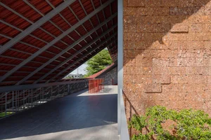 Discover the Unique Laterite Stone House with an Innovative Folding Roof in Saigon - image 3