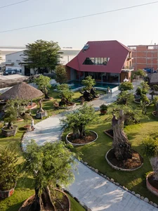 Discover the Unique Laterite Stone House with an Innovative Folding Roof in Saigon - image 4