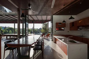 Discover the Unique Laterite Stone House with an Innovative Folding Roof in Saigon - image 6