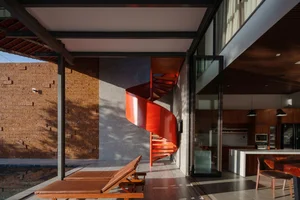 Discover the Unique Laterite Stone House with an Innovative Folding Roof in Saigon - image 0
