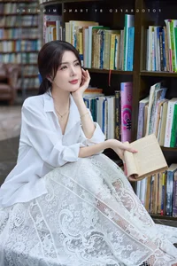 Lilly Luta's Timeless Beauty: Radiating Elegance in a Classic White Shirt - image 6