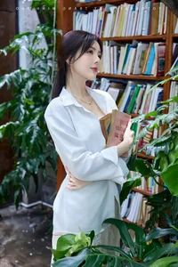 Lilly Luta's Timeless Beauty: Radiating Elegance in a Classic White Shirt - image 2