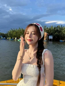 Tiktoker Ngan Ha Captures Hearts with Graceful Photos on Hoi An Basket Boats - image 0