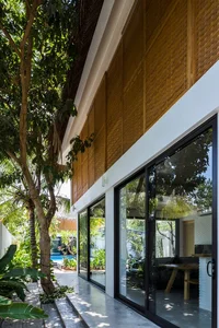 Tropical Twin Houses: Multi-Generational Living Harmonized with Nature in Tra Vinh - image 20
