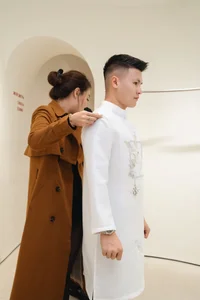Footballer Quang Hai and Wife to Wear Traditional Sacred Bird Ao Dai - image 0