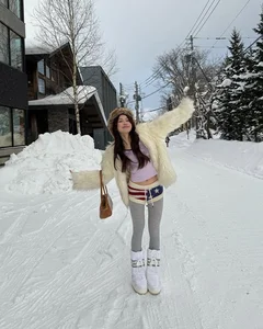 Braving the Cold: Viral TikToker Stuns in Bikini Amidst Snowy Winter Landscape - image 7