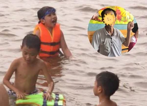 Heroic Rescue in Da Nang: Man Saves Two Children from Rough Seas - image 1