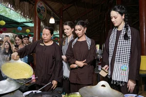 International Beauty Queens Experience Traditional Fish Catching in Vietnam's Mekong Delta - image 2