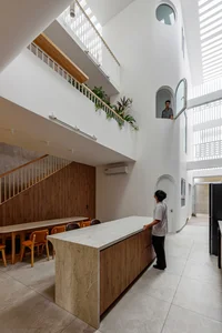 Stunning 200-Square-Meter Townhouse Inspired by Mountain Light Clefts - image 12