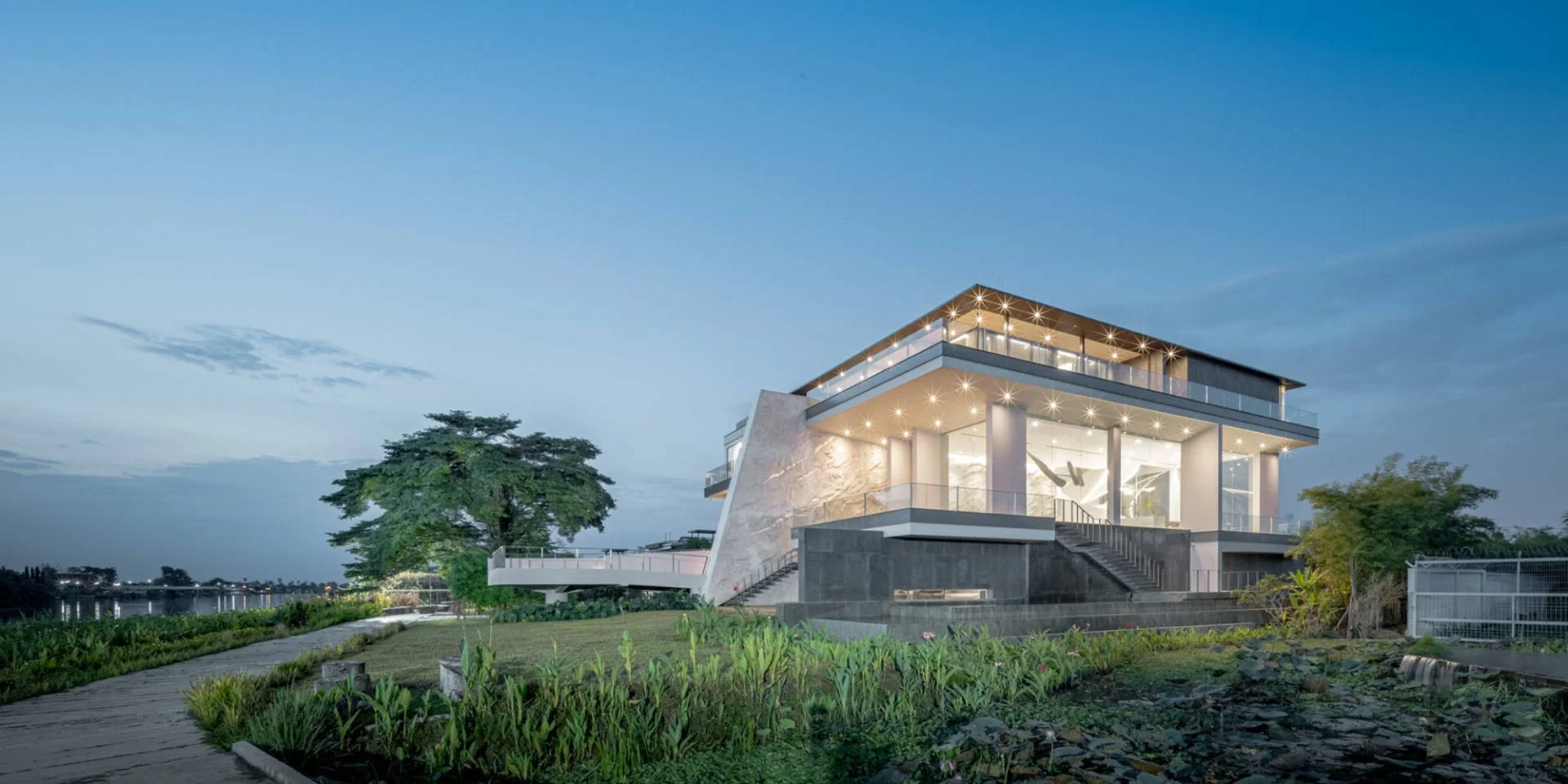 Stunning Riverside Minimalist Villa in Nakhon Pathom, Thailand: A Modern Architectural Masterpiece Designed for Golden Hour Sunsets and Serene Slow Living.
