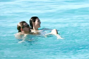 Famous Model Spotted in Chic Bikini During Romantic Beach Getaway - image 4