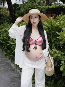 Joyce Pham Redefines Maternity Beach Style - image 3