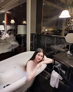 Stunning Beauty and Elegance: A Captivating Bathtub Portrait Gallery Exploring Modern Self-Care Aesthetics - image 4