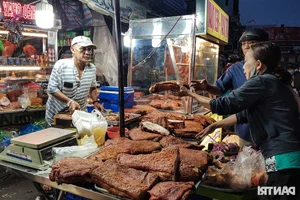 God of Wealth Day Food Traditions: Grilled Fish and Roast Duck in Ho Chi Minh City - image 1