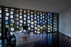 The Unique Kaleidoscope Glass Building Nestled Between Mountains and Sea - image 6