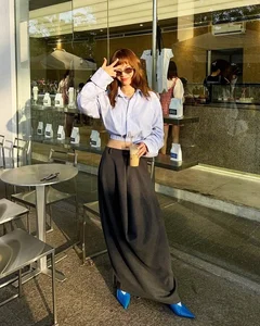 How Vietnamese Celebrities Elevate Their Style with Classic A-Line Midi Skirts - image 1