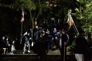 Early Morning Pilgrimage: Thousands Gather at Sacred Peaks - image 4